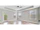 Bright bedroom with tray ceiling, ceiling fan, and private balcony access at 1485 Bourne Xing, Mount Pleasant, SC 29466