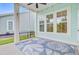Relaxing screened porch with a blue and white seashell rug and neighborhood view at 1485 Bourne Xing, Mount Pleasant, SC 29466