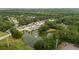 Aerial view of community with ponds and mature trees, showcasing the residential neighborhood at 1505 Blaze Ln, Charleston, SC 29412