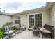 Back patio with outdoor seating and sliding doors leading into the house at 1505 Blaze Ln, Charleston, SC 29412
