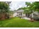 Expansive backyard with artificial turf, comfortable seating, and a privacy fence, ideal for relaxation at 1505 Blaze Ln, Charleston, SC 29412