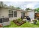 Charming backyard with a cozy patio, well-manicured artificial lawn, and lovely garden beds at 1505 Blaze Ln, Charleston, SC 29412