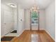 A dining area illuminated by a modern chandelier with gleaming hardwood floors at 1505 Blaze Ln, Charleston, SC 29412