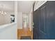 Inviting entryway with hardwood floors offering views into the kitchen and living areas at 1505 Blaze Ln, Charleston, SC 29412