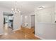 Entryway view with hardwood floors that flows to the kitchen, dining, and living room at 1505 Blaze Ln, Charleston, SC 29412