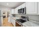 Stainless steel oven range and microwave above marble countertop in bright kitchen at 1505 Blaze Ln, Charleston, SC 29412