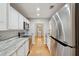 Well-lit kitchen featuring stainless steel appliances, white cabinets, and beautiful countertops at 1505 Blaze Ln, Charleston, SC 29412