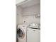 A laundry room with a washer and dryer, as well as wire shelving above at 1505 Blaze Ln, Charleston, SC 29412