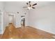 Spacious living room with ceiling fan and hardwood floors flows into the kitchen at 1505 Blaze Ln, Charleston, SC 29412