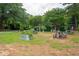 Community picnic area featuring multiple picnic tables, landscaping and mature trees at 1505 Blaze Ln, Charleston, SC 29412