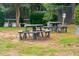 Community picnic area with multiple picnic tables and mature landscaping and trees at 1505 Blaze Ln, Charleston, SC 29412