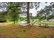 Scenic pond view with a hammock and picnic table, perfect for relaxation and outdoor enjoyment at 1505 Blaze Ln, Charleston, SC 29412