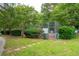 Neighborhood tennis court enclosed with a fence and surrounded by greenery at 1505 Blaze Ln, Charleston, SC 29412