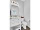 Clean, well-lit half bathroom featuring a white vanity, mirror, and toilet at 1550 Spring Moss Rd, Mount Pleasant, SC 29466