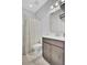 Bathroom featuring a vanity with storage, a framed mirror, and a shower with a decorative curtain at 1550 Spring Moss Rd, Mount Pleasant, SC 29466