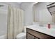 Cozy bathroom featuring a vanity with storage, a framed mirror, and a shower with a decorative curtain at 1550 Spring Moss Rd, Mount Pleasant, SC 29466