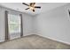 Inviting bedroom with neutral walls, a large window, and soft carpet, creating a serene and peaceful atmosphere at 1550 Spring Moss Rd, Mount Pleasant, SC 29466