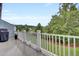 Outdoor deck featuring white railings overlooking the lawn and landscaping at 1550 Spring Moss Rd, Mount Pleasant, SC 29466