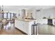 Open concept kitchen featuring a large kitchen island with granite countertop and white cabinets at 1550 Spring Moss Rd, Mount Pleasant, SC 29466