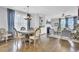 Open-concept design showcases hardwood floors, fireplace, and dining area at 1550 Spring Moss Rd, Mount Pleasant, SC 29466