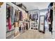 Spacious walk-in closet with custom shelving, ample storage and organization for clothes, shoes, and accessories at 1550 Spring Moss Rd, Mount Pleasant, SC 29466