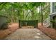 Backyard patio area with stone pathway leading to greenery and featuring a charming bird bath at 1612 John Fenwick Ln, Johns Island, SC 29455