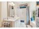 Bright bathroom with a marble vanity, sleek mirror, and a shower/tub combination with blue decor at 1612 John Fenwick Ln, Johns Island, SC 29455