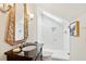 Bathroom featuring a walk-in shower with a glass enclosure, skylight, vanity with ornate mirror and a dark countertop at 1612 John Fenwick Ln, Johns Island, SC 29455