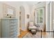 Cozy bedroom nook with dresser and a comfortable chair at 1612 John Fenwick Ln, Johns Island, SC 29455