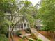 Beautiful home with lush landscaping, large staircase to the front porch, and a detached garage at 1612 John Fenwick Ln, Johns Island, SC 29455