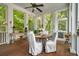 Covered porch features wood floors and ample natural light at 1612 John Fenwick Ln, Johns Island, SC 29455