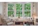Charming window seat area with built-in shelving offering a cozy spot for reading with lovely outdoor views at 1612 John Fenwick Ln, Johns Island, SC 29455