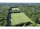Aerial view of neighborhood with soccer fields surrounded by lush green trees at 1616 Dotterers Run, Charleston, SC 29414