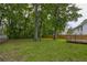 Expansive backyard with healthy green grass and mature trees providing a private outdoor space at 1616 Dotterers Run, Charleston, SC 29414