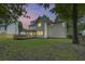 Large backyard with a wooden deck perfect for outdoor living and enjoying the property's landscape at 1616 Dotterers Run, Charleston, SC 29414