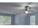 Neutral-toned bedroom with a ceiling fan and bright windows at 1616 Dotterers Run, Charleston, SC 29414