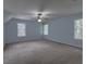 Neutral-toned bedroom with a ceiling fan and bright windows at 1616 Dotterers Run, Charleston, SC 29414