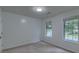 Bright bedroom with neutral carpet and two large windows at 1616 Dotterers Run, Charleston, SC 29414