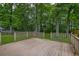 Spacious wooden deck overlooking a private, tree-filled backyard, perfect for outdoor relaxation and entertaining at 1616 Dotterers Run, Charleston, SC 29414