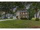 Charming two-story home with well-manicured lawn and mature trees at 1616 Dotterers Run, Charleston, SC 29414