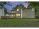 Two-story home exterior boasts a well-maintained lawn, back deck, and ample space, ideal for outdoor entertaining at 1616 Dotterers Run, Charleston, SC 29414