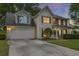 Charming home with a two-car garage, manicured lawn, and inviting front porch at 1616 Dotterers Run, Charleston, SC 29414
