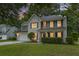Charming two-story home featuring a well-manicured lawn, shutters, and inviting front porch at 1616 Dotterers Run, Charleston, SC 29414