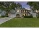 Inviting two-story home with green lawn and manicured shrubbery beneath front windows at 1616 Dotterers Run, Charleston, SC 29414