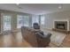 Spacious living room with a fireplace, comfortable seating, and lots of natural light at 1616 Dotterers Run, Charleston, SC 29414