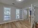 Bright and airy living room with beautiful hardwood floors and large windows at 1616 Dotterers Run, Charleston, SC 29414