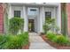 Pathway to the condo entrance with lush greenery and brick accents, leading to units 161-168 at 163 Golfview Ln, Summerville, SC 29485