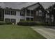 Charming two-story home boasts a well-manicured lawn, inviting curb appeal, and a delightful screened porch at 163 Golfview Ln, Summerville, SC 29485