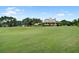 Expansive home with a lush green lawn, a manicured landscape and an American flag at 163 Golfview Ln, Summerville, SC 29485