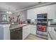 Kitchen features stainless steel appliances, including a dishwasher and oven, complemented by modern white cabinetry at 163 Golfview Ln, Summerville, SC 29485
